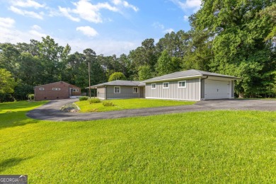 This beautifully remodeled home is set on a serene 3.52-acre