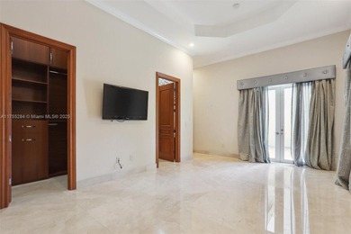 Welcome to a modern Pinecrest masterpiece! This 9,912-sq-ft home