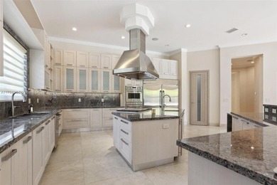 Welcome to a modern Pinecrest masterpiece! This 9,912-sq-ft home