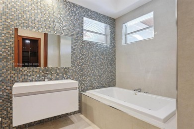 Welcome to a modern Pinecrest masterpiece! This 9,912-sq-ft home