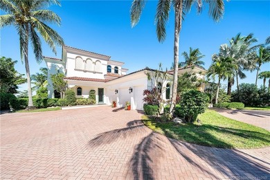 Water, water everywhere! This stunning Sailfish Point residence