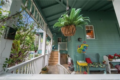 Attention car collectors!!! This unique lushly landscaped 3