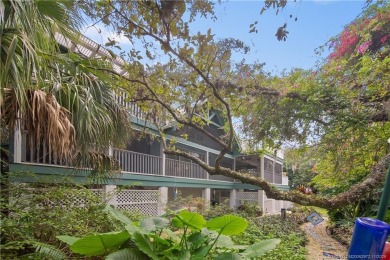 Attention car collectors!!! This unique lushly landscaped 3