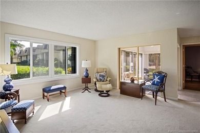 Enjoy the ease of Florida living in this first floor, end unit