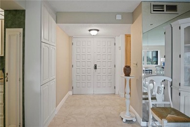 Enjoy the ease of Florida living in this first floor, end unit