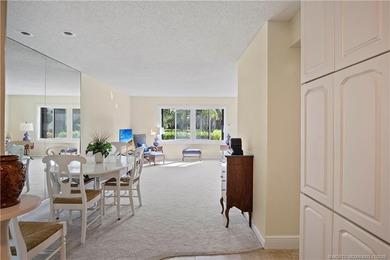 Enjoy the ease of Florida living in this first floor, end unit