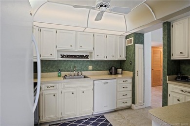 Enjoy the ease of Florida living in this first floor, end unit