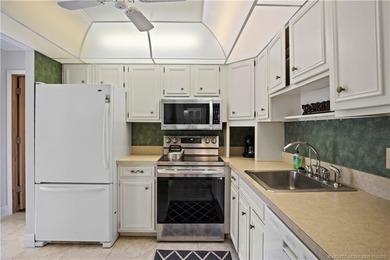 Enjoy the ease of Florida living in this first floor, end unit