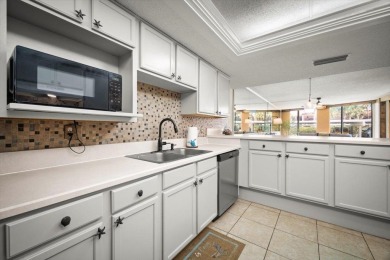 Easy beach access from this updated ground floor condominium at