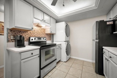 Easy beach access from this updated ground floor condominium at