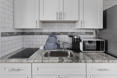 Welcome to Harbor Lights Unit 311. This Charming Third (Top)