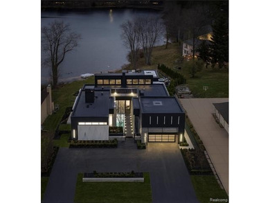 A stunning expression of modern lake-area living, this