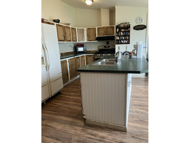 Manufactured 3-2 with an open living space, front deck, handicap