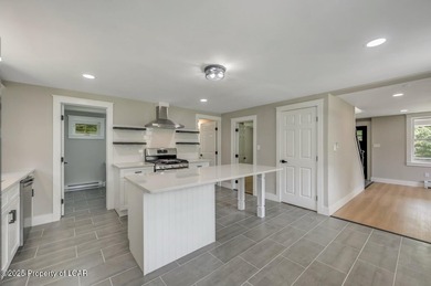 This beautifully remodeled 4-bedroom, 2.5-bath farmhouse sits on