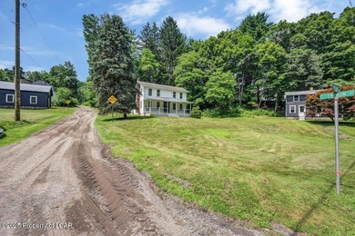 This beautifully remodeled 4-bedroom, 2.5-bath farmhouse sits on