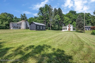 This beautifully remodeled 4-bedroom, 2.5-bath farmhouse sits on