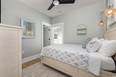 Just a quarter mile from the beach, this stunning 5-bedroom, 5