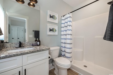 Just a quarter mile from the beach, this stunning 5-bedroom, 5