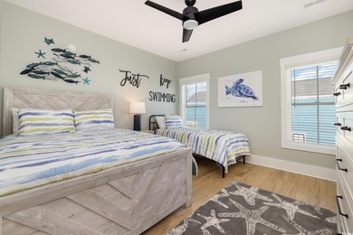 Just a quarter mile from the beach, this stunning 5-bedroom, 5