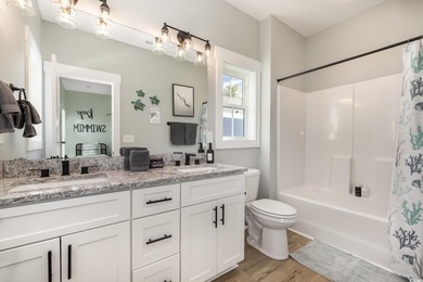 Just a quarter mile from the beach, this stunning 5-bedroom, 5