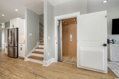 Just a quarter mile from the beach, this stunning 5-bedroom, 5