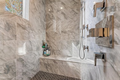 Enjoy the elegance of this custom, over 9,000 square ft estate