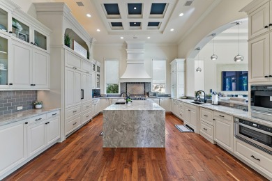 Enjoy the elegance of this custom, over 9,000 square ft estate