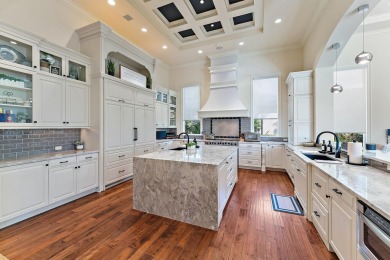 Enjoy the elegance of this custom, over 9,000 square ft estate