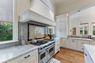 Enjoy the elegance of this custom, over 9,000 square ft estate