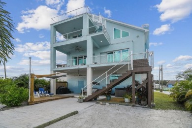 Stunning custom waterfront home. 3-bedroom, 3-bath, this