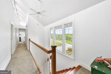 Nestled along the shores of Lake Oconee, this extraordinary