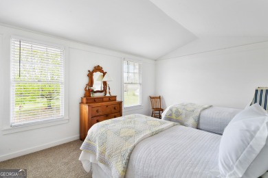 Nestled along the shores of Lake Oconee, this extraordinary