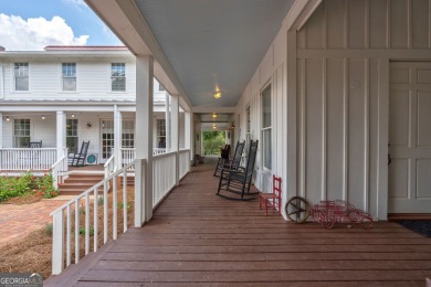 Nestled along the shores of Lake Oconee, this extraordinary