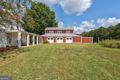 Nestled along the shores of Lake Oconee, this extraordinary