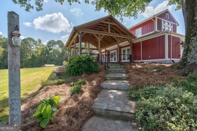 Nestled along the shores of Lake Oconee, this extraordinary