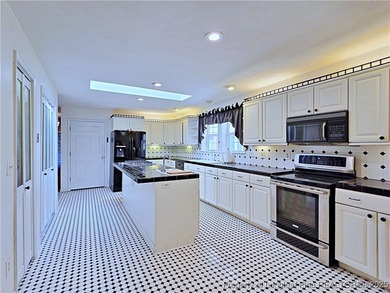 This spacious 4 bedroom, 3 bath brick ranch offers serene lake