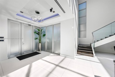 Discover luxury in this custom modern home on a premier Las Olas