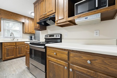 This spacious coastal home sits in the middle of a generous