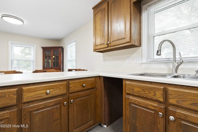 This spacious coastal home sits in the middle of a generous