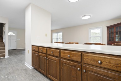 This spacious coastal home sits in the middle of a generous