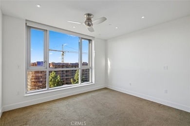 Experience luxury high-rise living at its finest in this