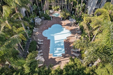 Nestled in the coveted El Escorial Villas just steps from East