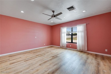 Welcome to a truly rare Cape Coral waterfront estate located on