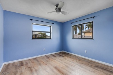 Welcome to a truly rare Cape Coral waterfront estate located on