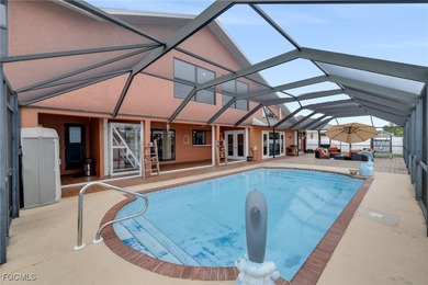 Welcome to a truly rare Cape Coral waterfront estate located on