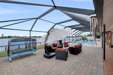 Welcome to a truly rare Cape Coral waterfront estate located on