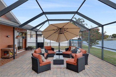 Welcome to a truly rare Cape Coral waterfront estate located on