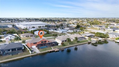 Welcome to a truly rare Cape Coral waterfront estate located on