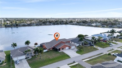 Welcome to a truly rare Cape Coral waterfront estate located on