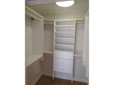 GATED 1 BDR 1.5 BATH TILED UNIT WITH WATER VIEW. 1 BLOCK TO